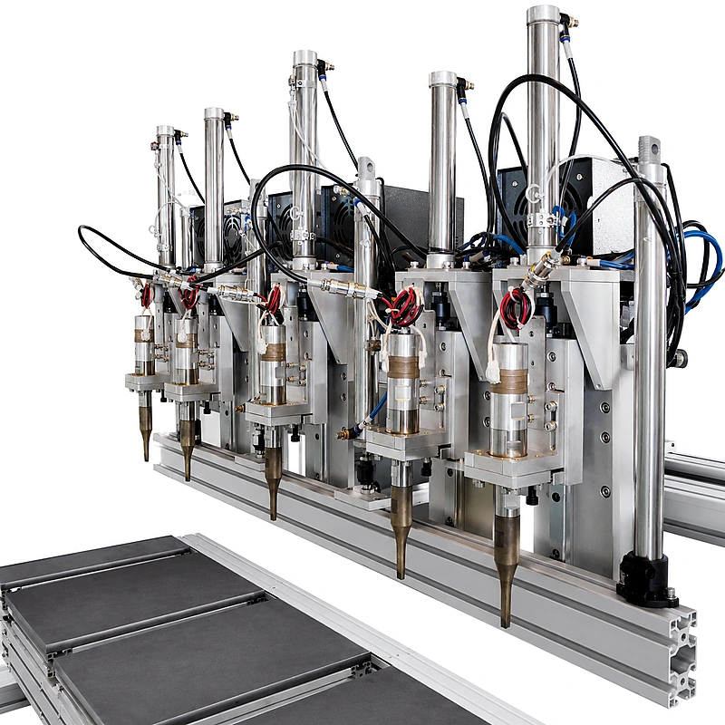 Multi-head permeate carrier cutting and ultrasonic welding station