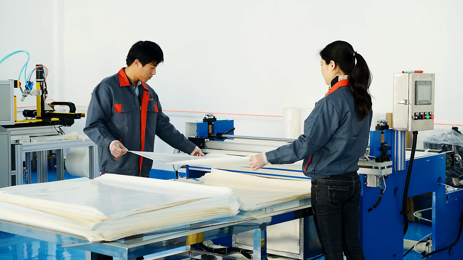Technicians preparing RO membrane sheet for supplier evaluation