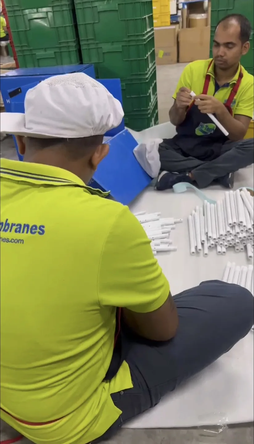 WECOME and Hitech Membranes teams discussing the production process