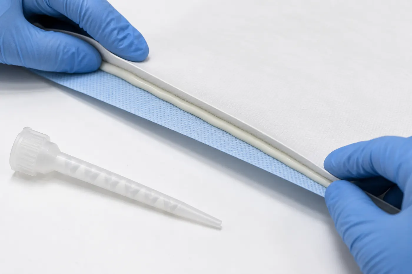 Inspection of adhesive bead continuity during membrane leaf assembly