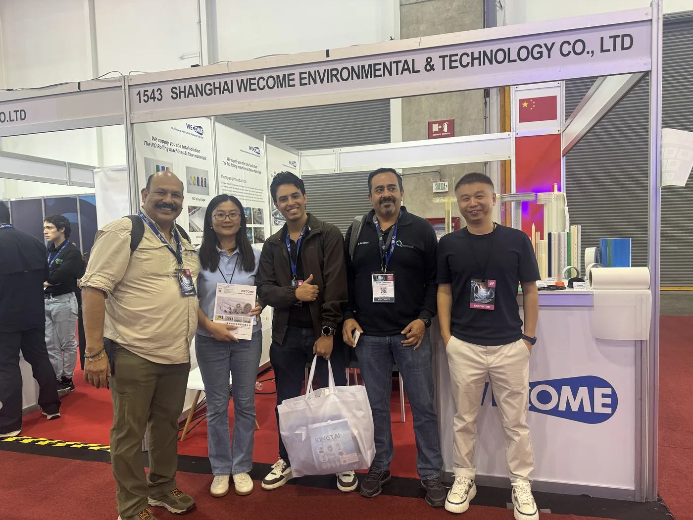 WECOME team with water industry visitors at booth 1543 during Aquatech Mexico 2026
